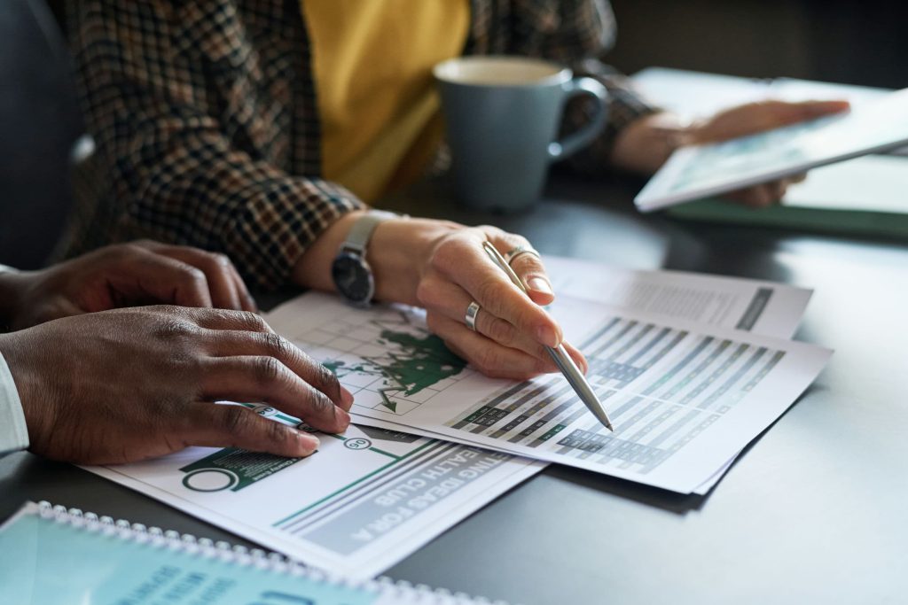 business-people-analyzing-report