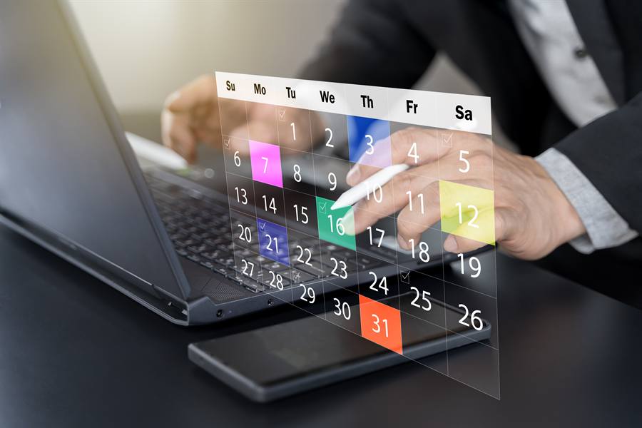 Appointments and reminders being scheduled on a digital calendar.