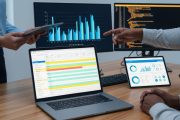 vecteezy_business-professionals-analyzing-data-and-charts-on-multiple_70685944