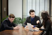 Young business team discussing and studying statistics in a meeting room